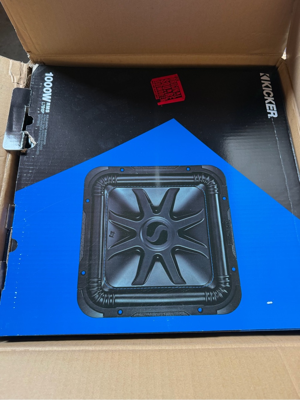 Kickers Black Subwoofer Enclosure with Blue Manual and Yellow Sticker